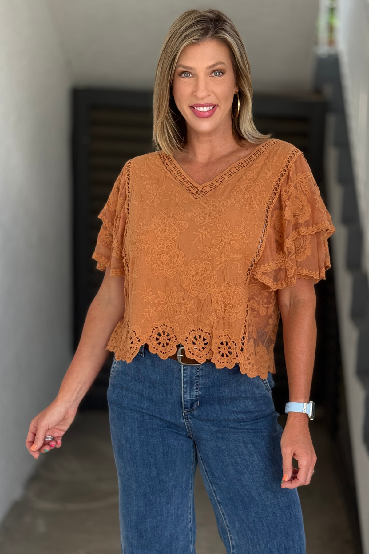 Women’s caramel eyelet blouse with V-neckline
