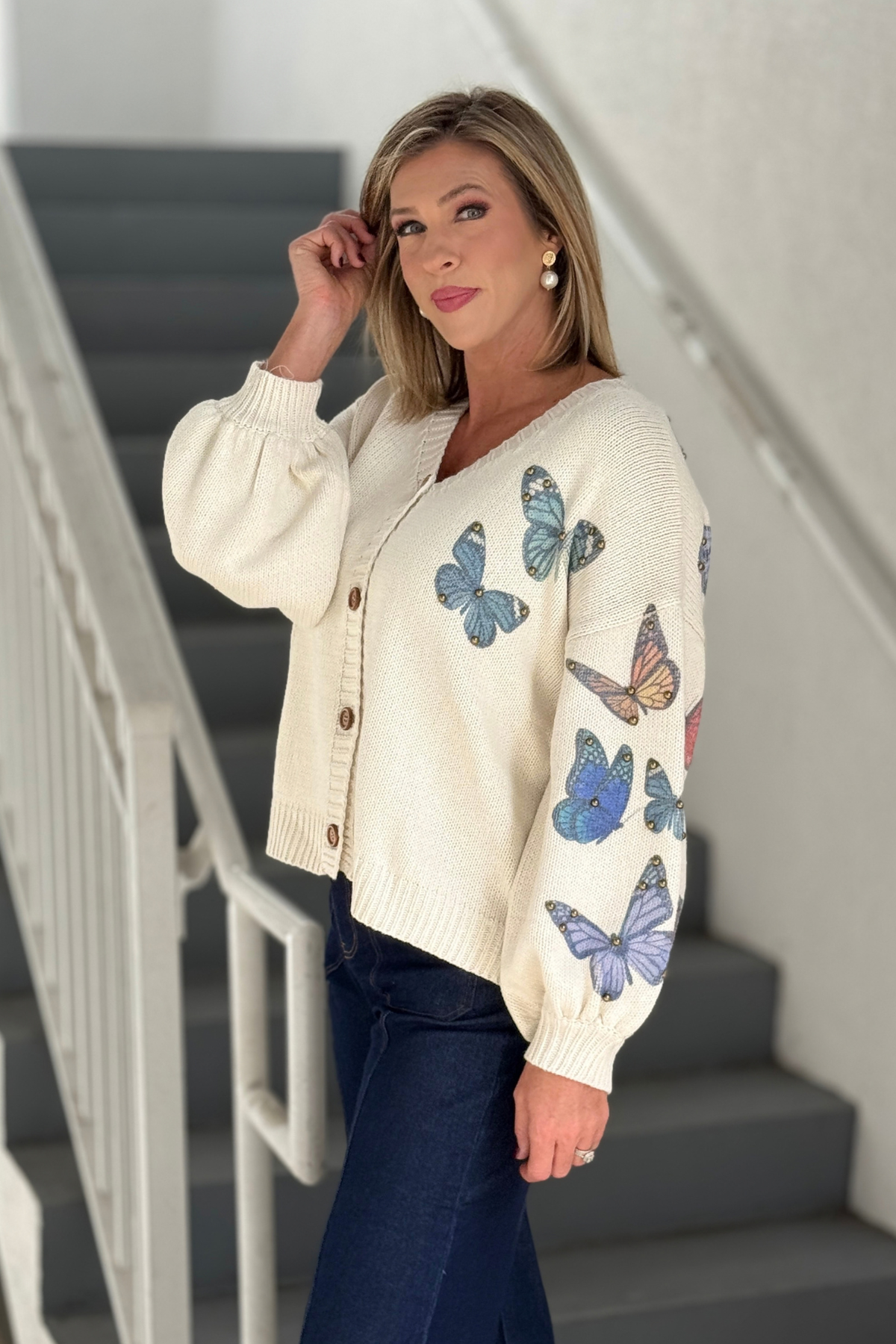 Ivory knit sweater cardigan with butterfly details