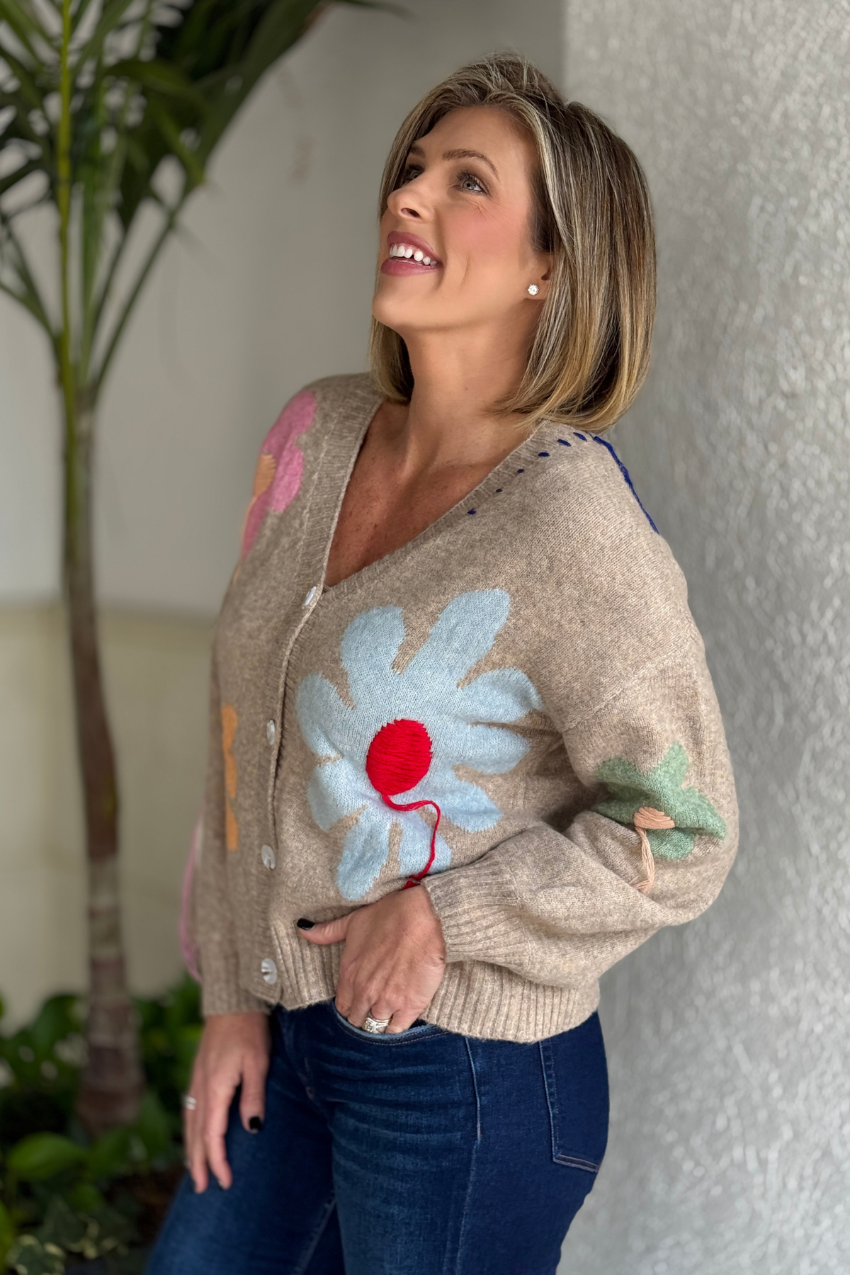 close up of 3D flower texture on women’s boutique cardigan