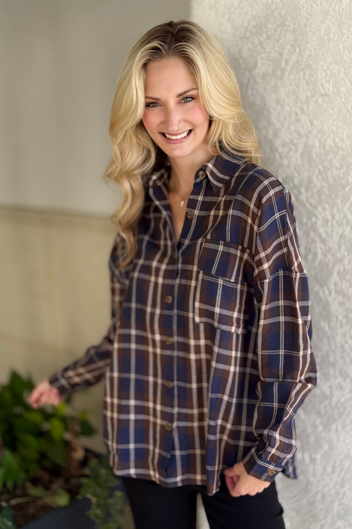 Women’s navy and brown plaid long sleeve collared top