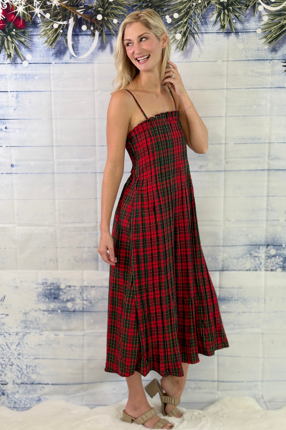 Tartan Christmas dress with ruffle neckline and flowing midi skirt