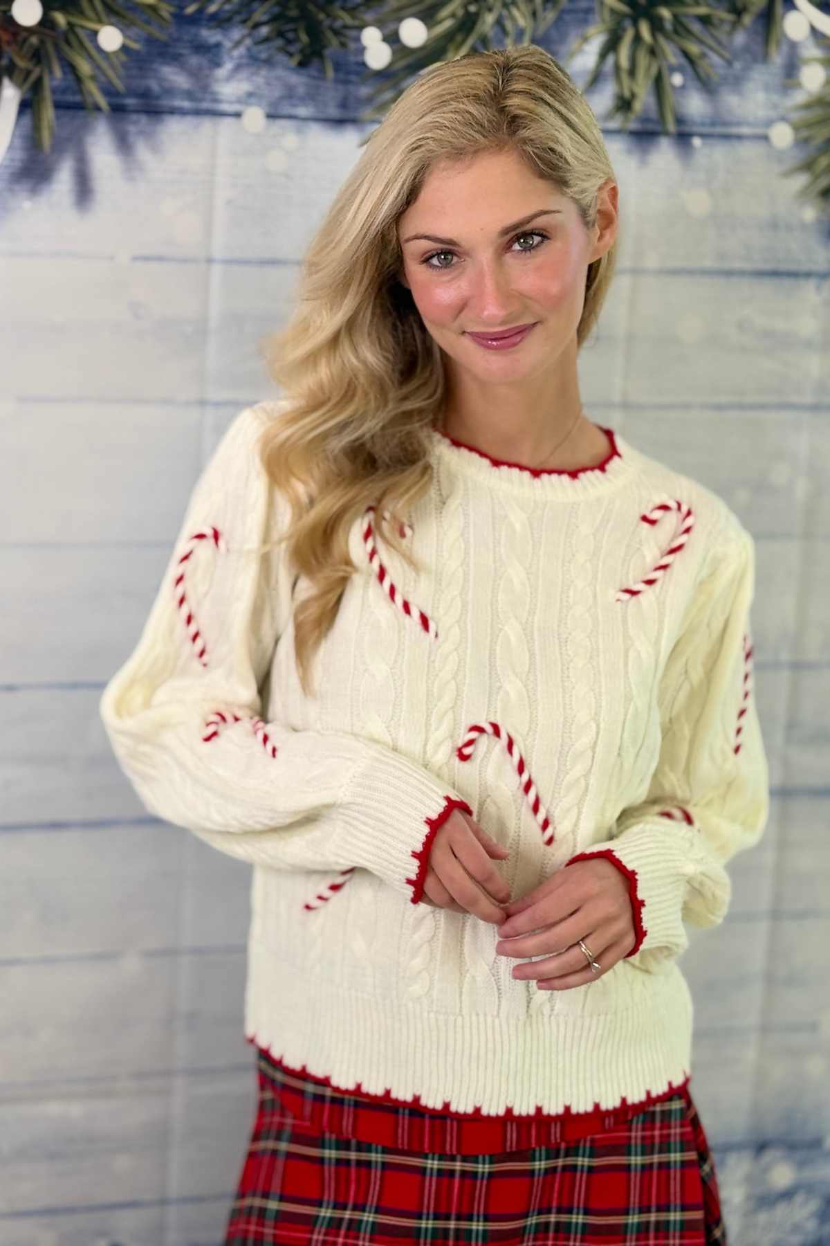 Ivory candy cane cable knit Christmas sweater
