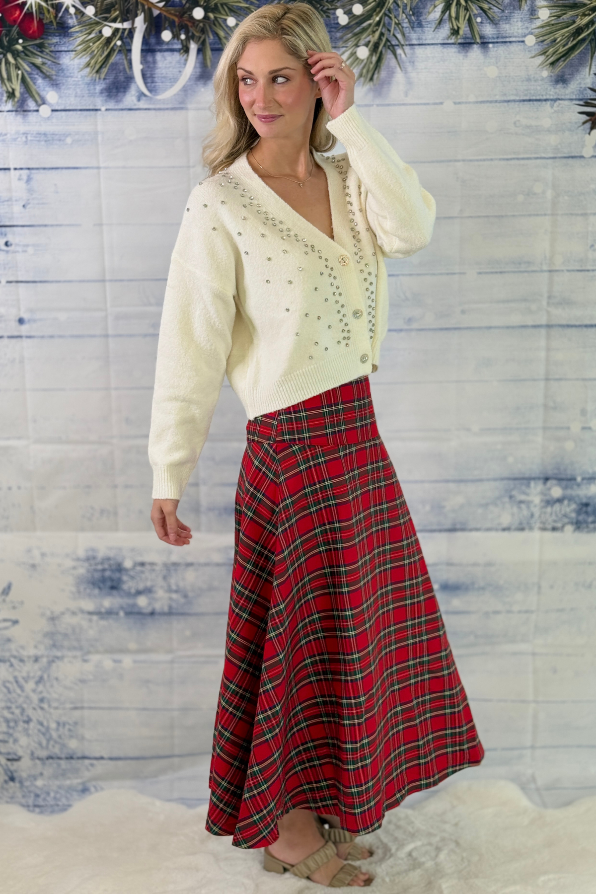 Tartan midi skirt styled with ivory Christmas sweater