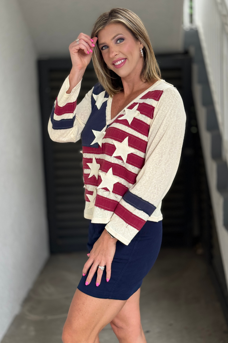 Lightweight patriotic women’s top styled with navy skirt