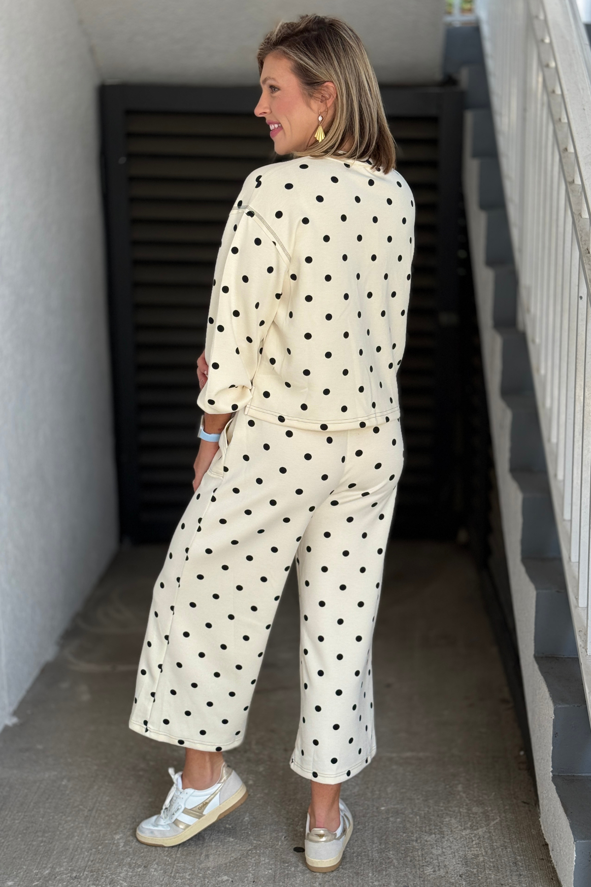 Cream and black scuba two piece set styled with sneakers