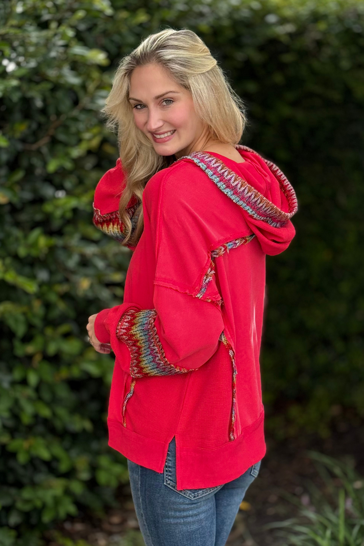 Back view of red mineral washed oversized hoodie with relaxed fit