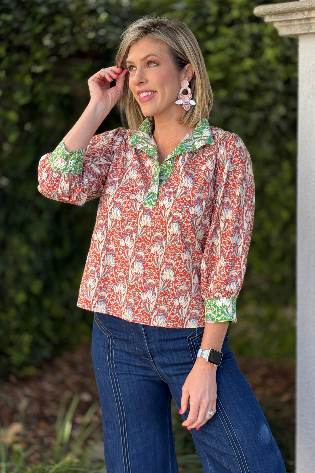 Spring color block floral blouse styled with white pants