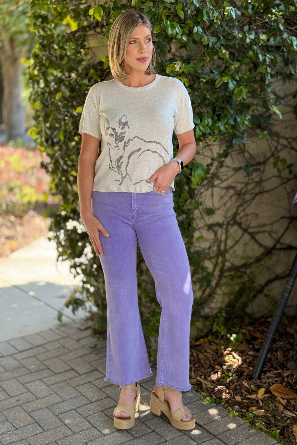 wide leg lavender jeans styled with neutral top