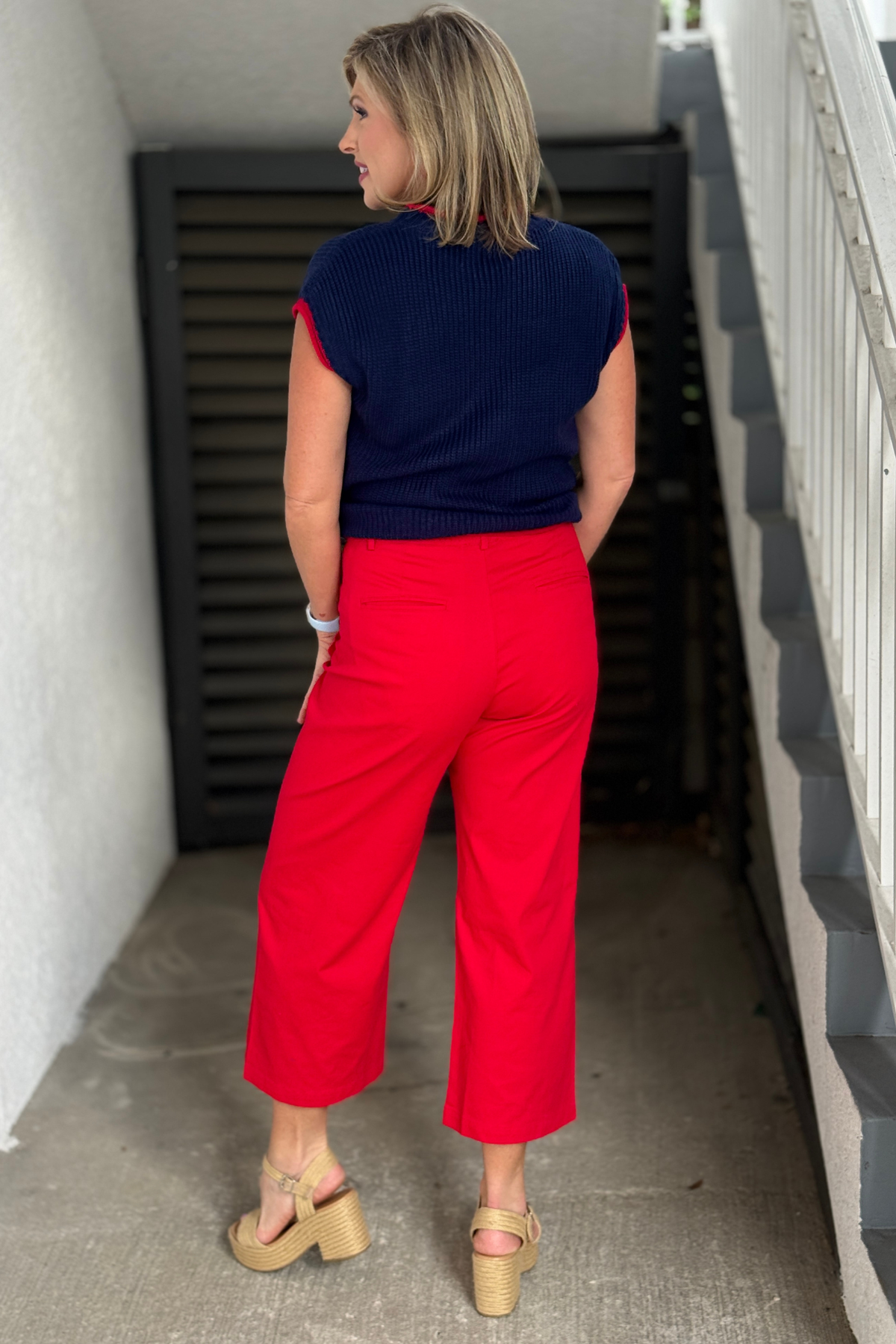 Statement red pants styled with patriotic sweater vest