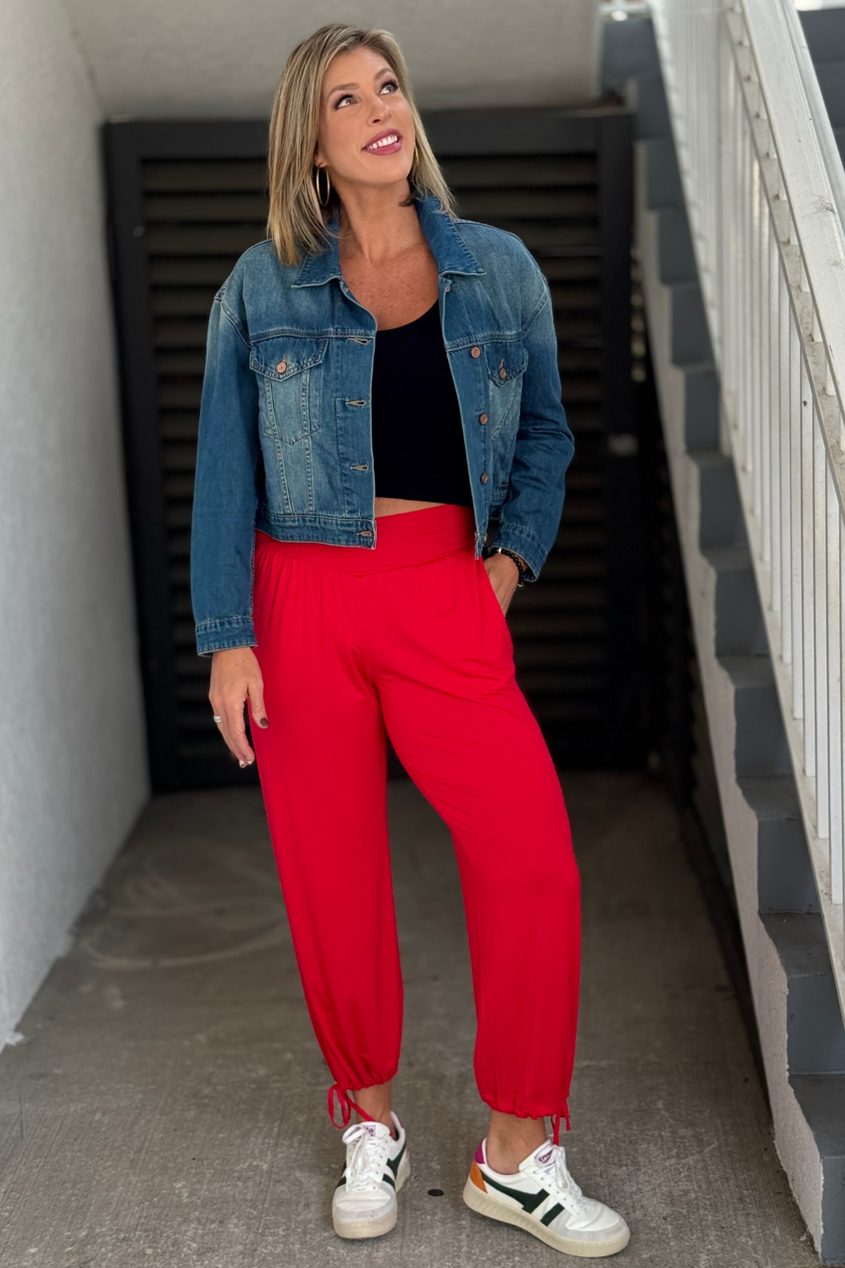 The Switch It Up cherry red modal crossover pants on model