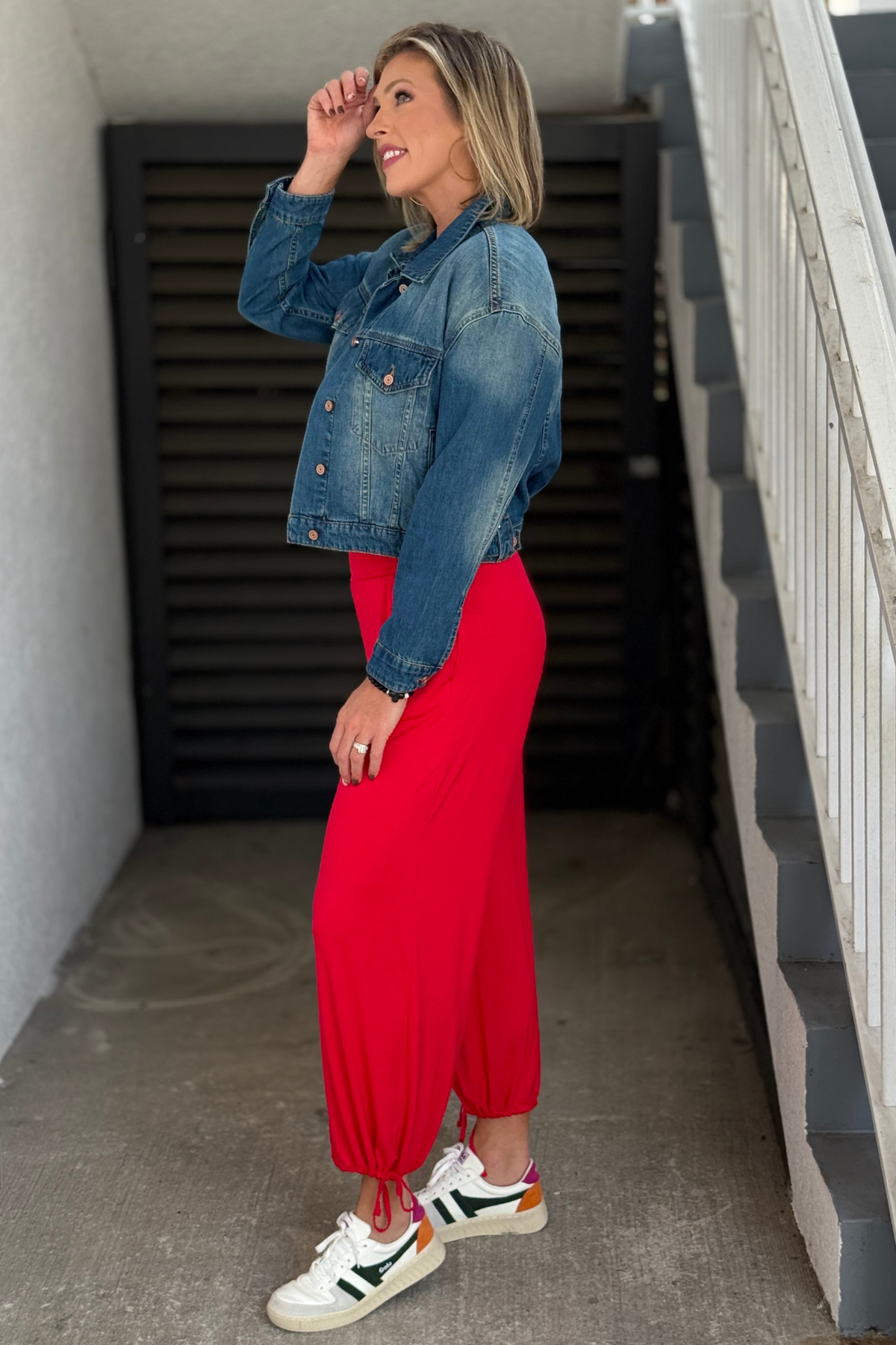 Cherry red silky modal pants with side pockets and adjustable ankle ties