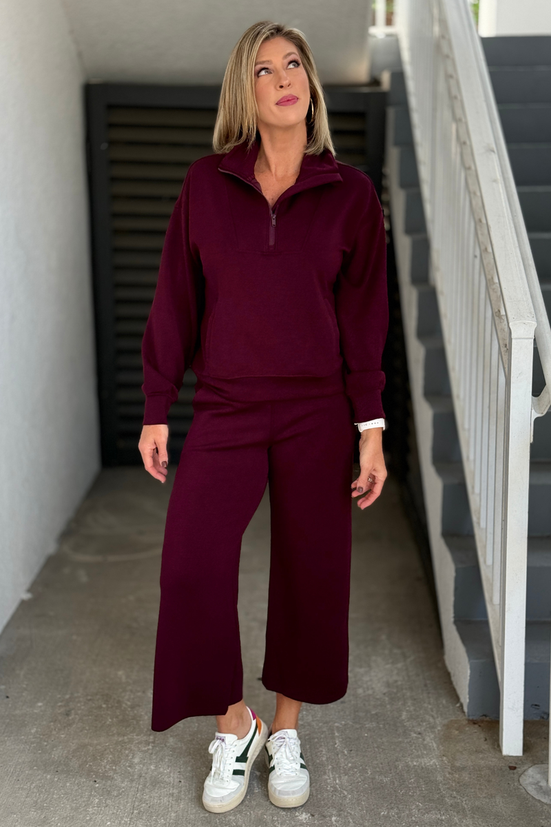 Women’s burgundy quarter zip matching set with wide leg pants