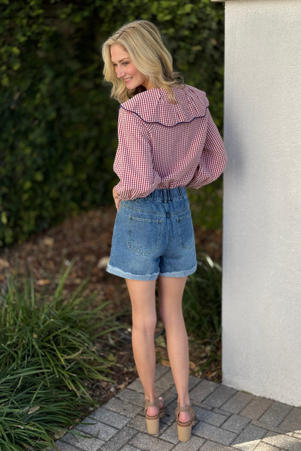 Distressed hem high rise denim shorts with strawberry embroidery