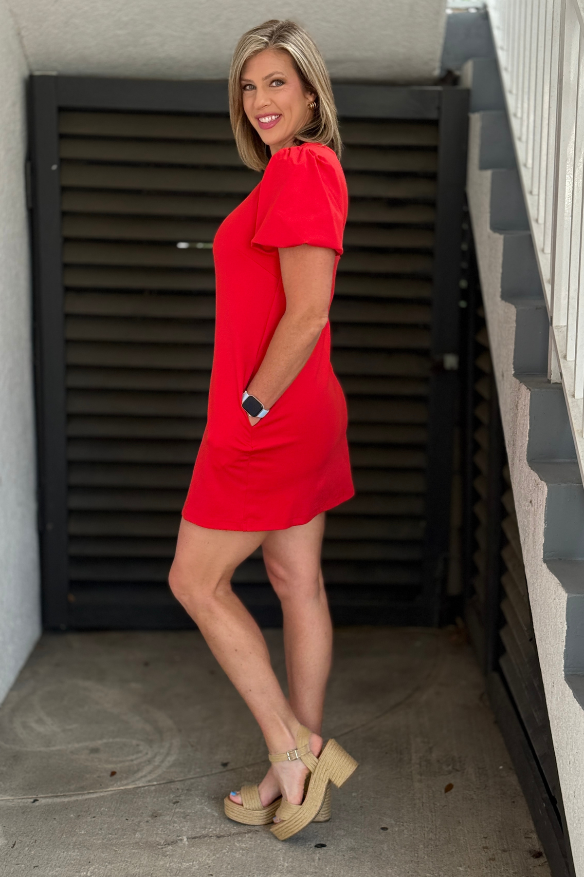 Red V-neck mini dress styled with platform sandals