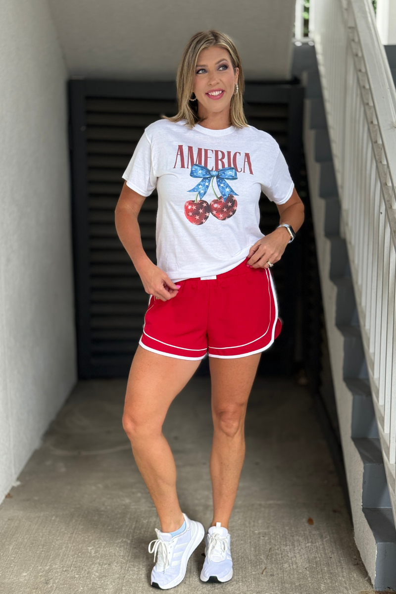 Lightweight red active shorts with white trim