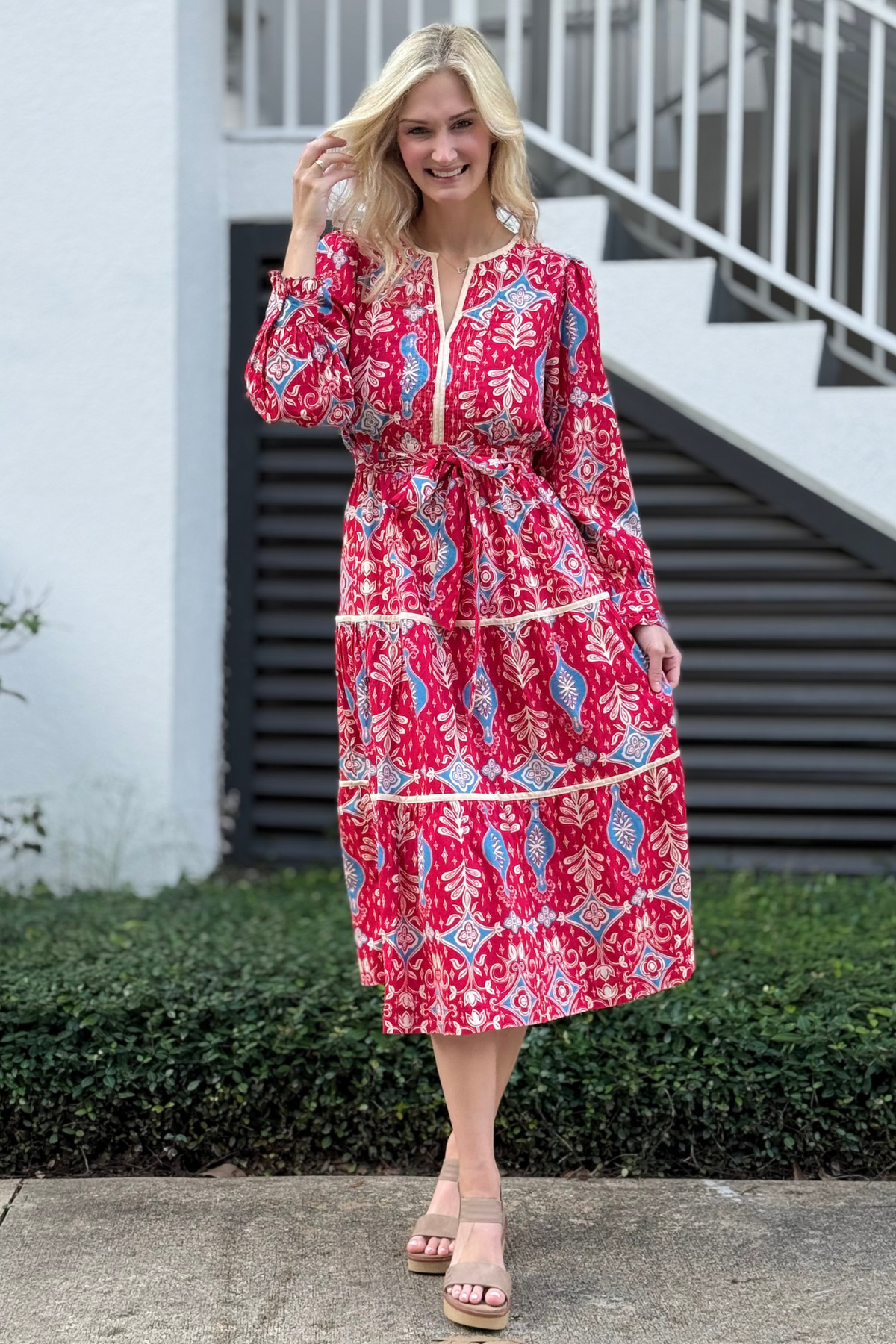 Close-up of red and blue boho print with contrast binding detail