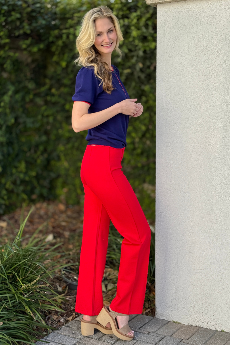 Side view of true red ponte pants showing tailored center seam detail