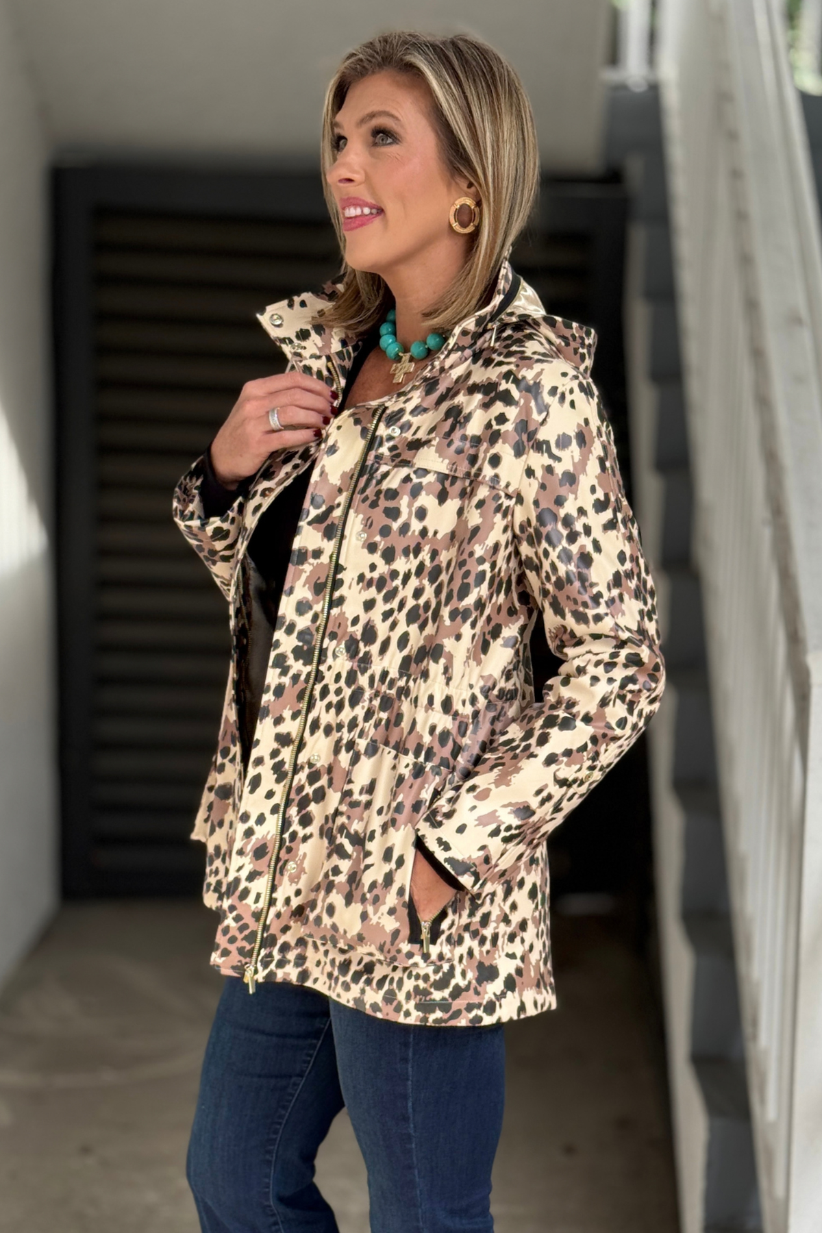 Front view of Renuar leopard waterproof rain jacket