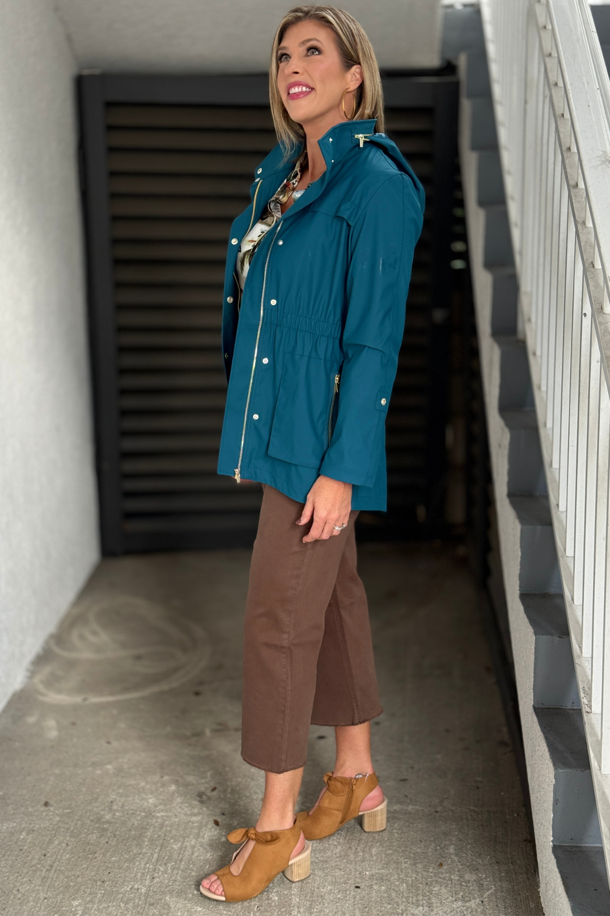Lightweight teal fall jacket with gold zippered pockets