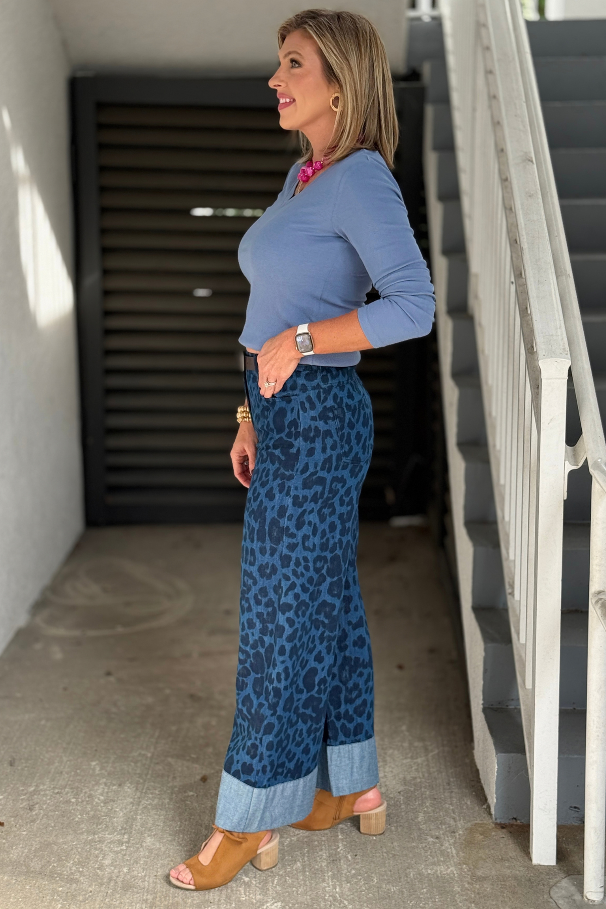 Indigo leopard denim pants styled with blue V-neck top