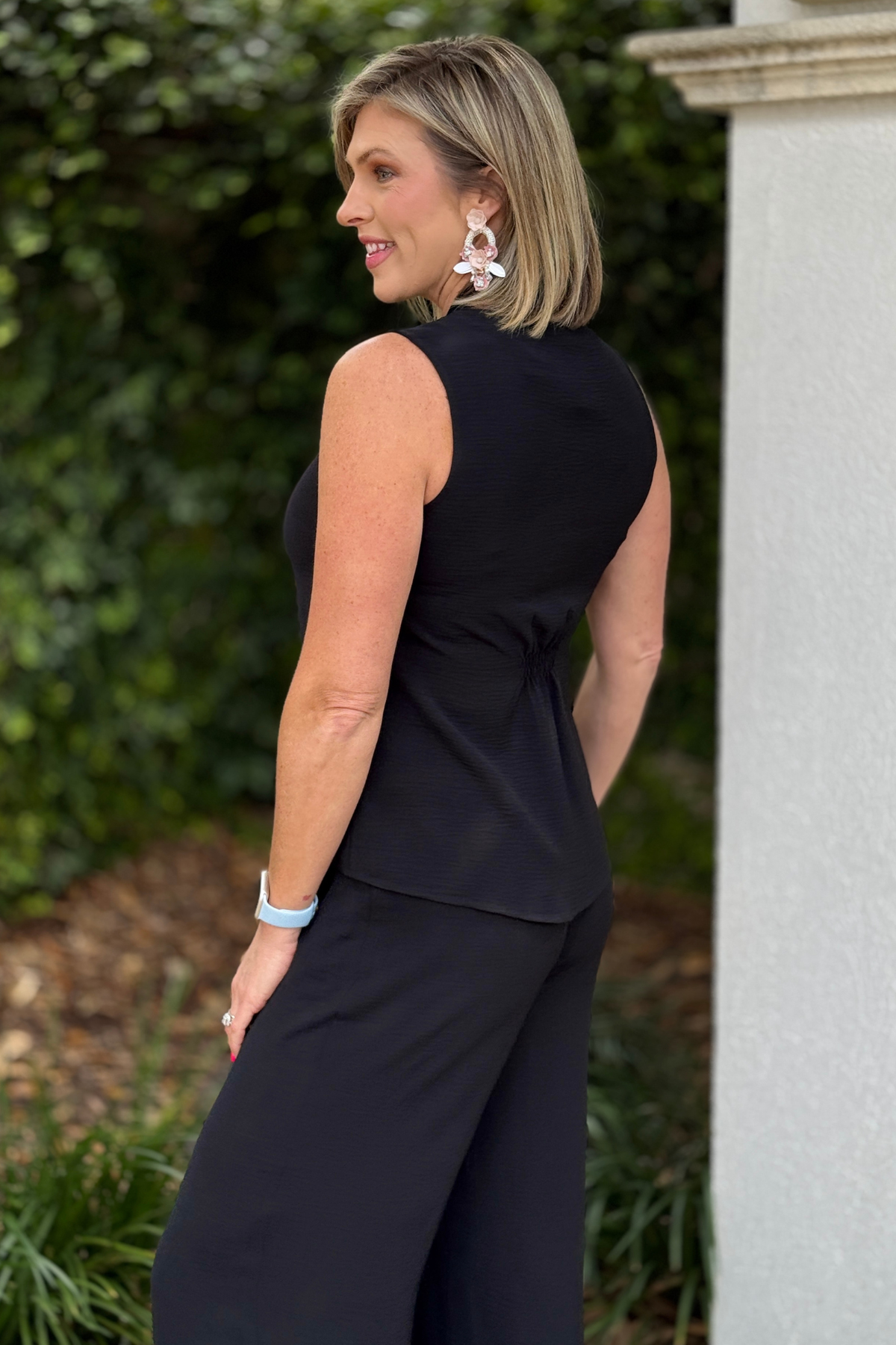 Lightweight black blouse for layering under blazer