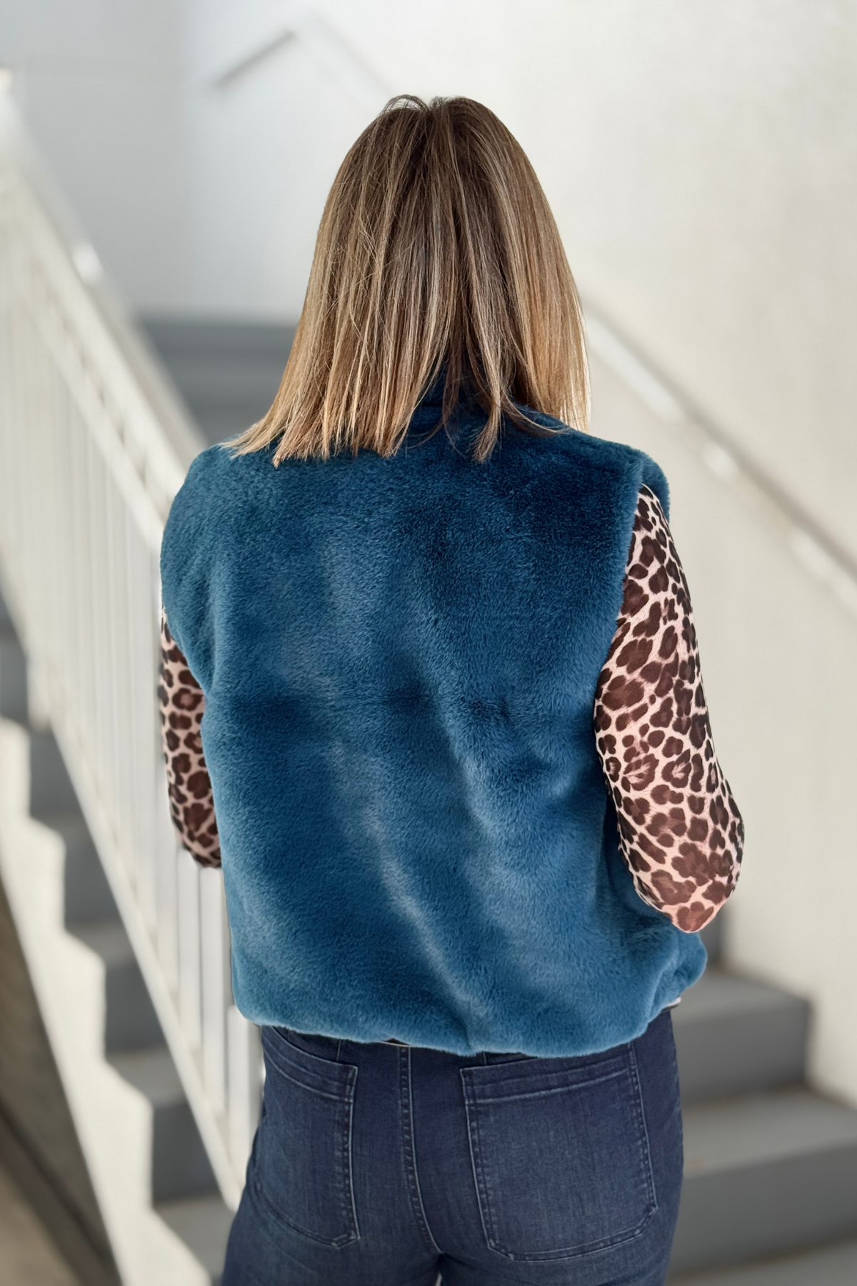 Plush Deep Sea faux fur vest for women
Renuar women’s faux fur vest styled with dark denim