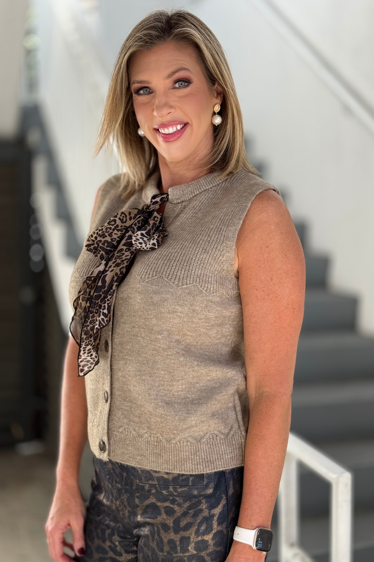 Renuar sleeveless knit vest styled with leopard bow tie
