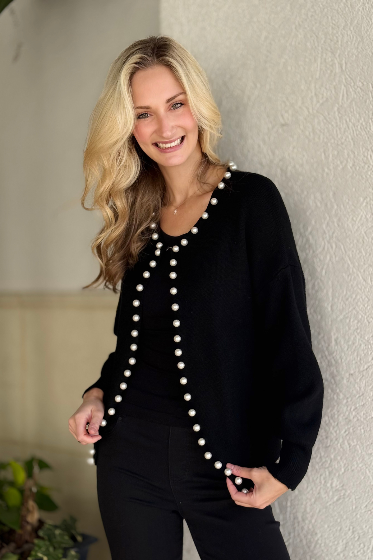 Women’s pearl embellished black sweater