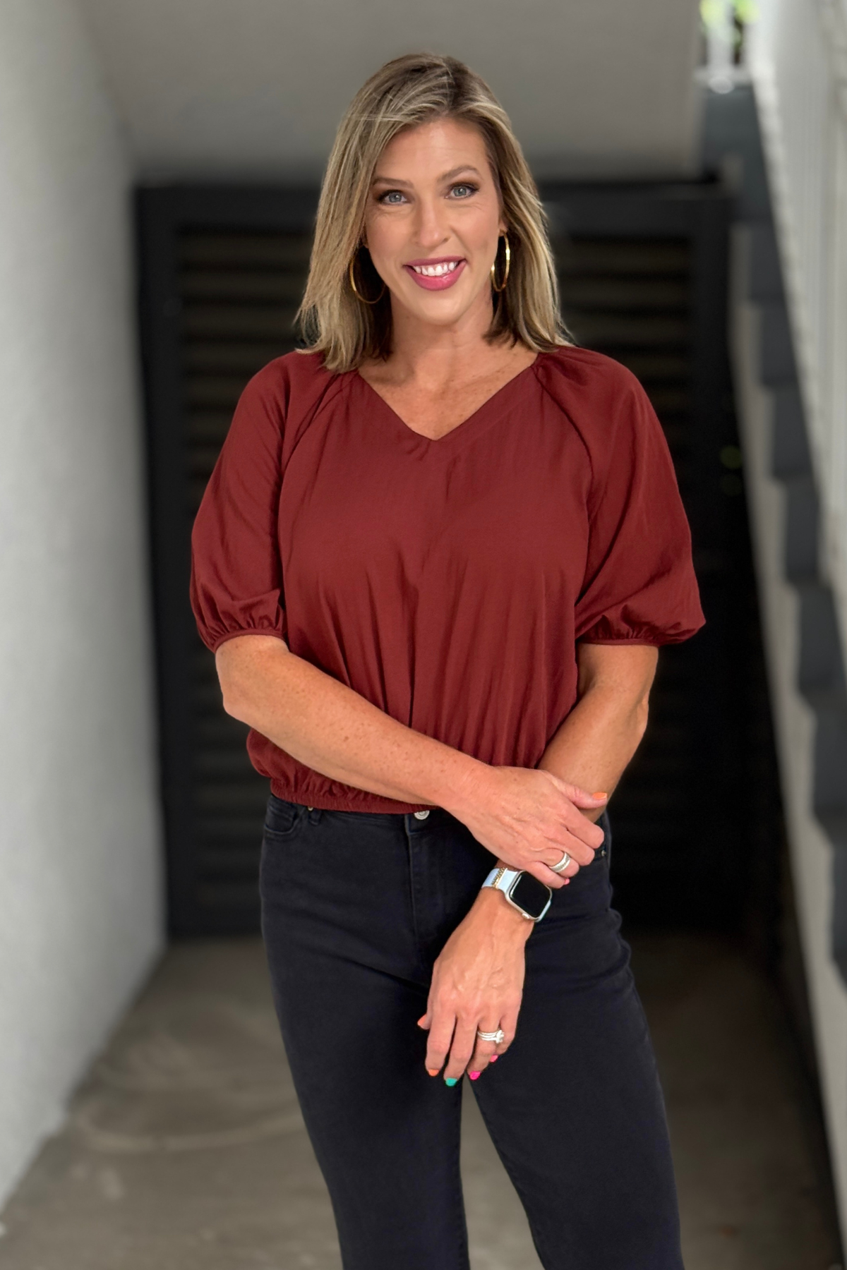Women's rust bubble hem blouse with puff sleeves