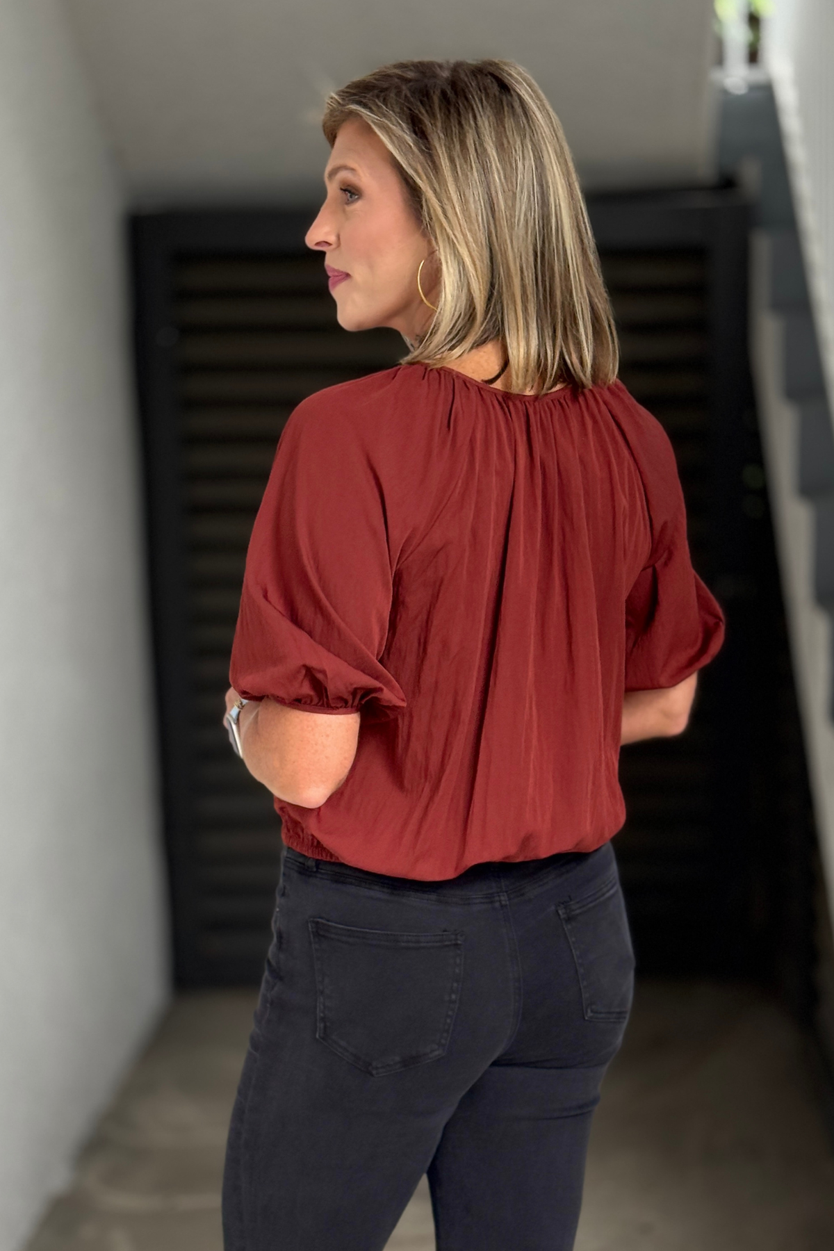Women's boutique rust bubble hem top