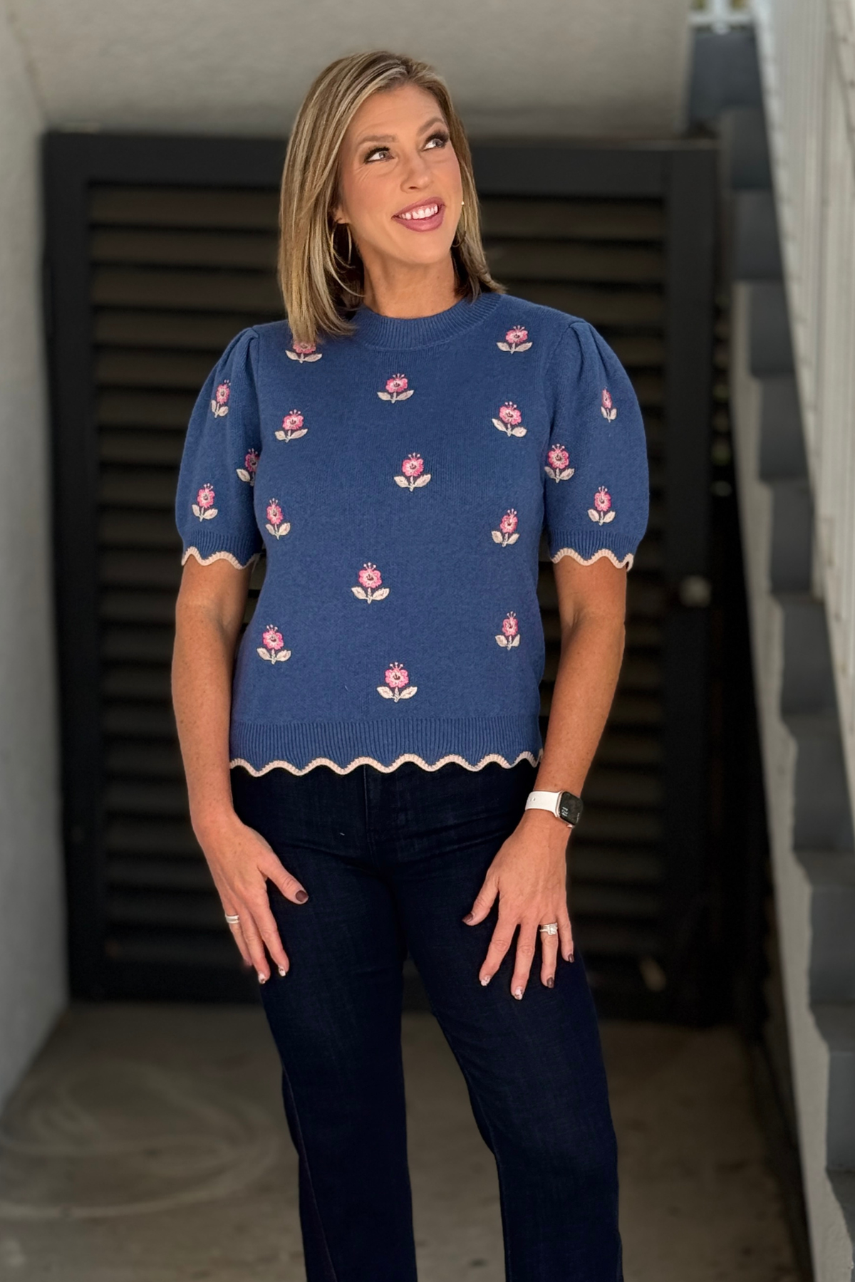 Blue floral embroidered puff sleeve sweater top on model