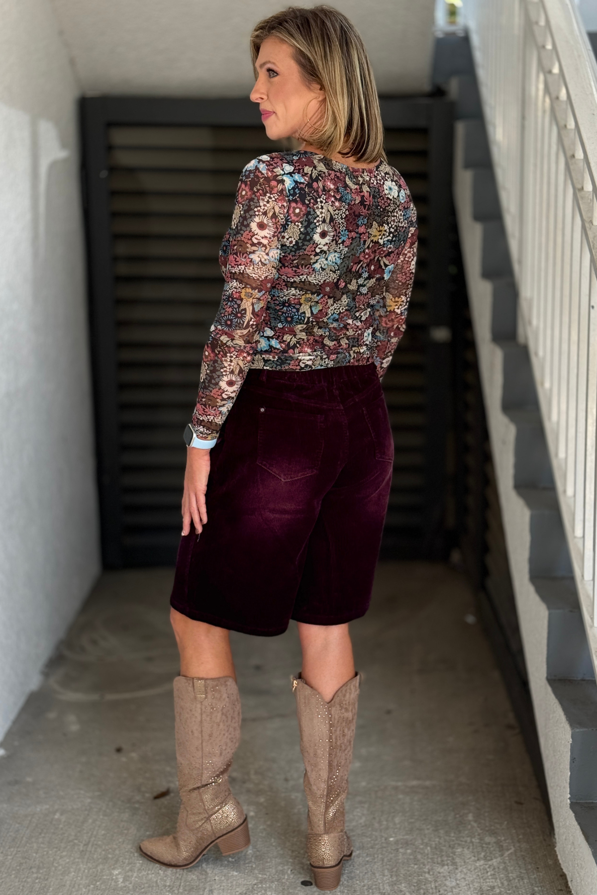 Back view of women's burgundy corduroy Bermuda shorts
