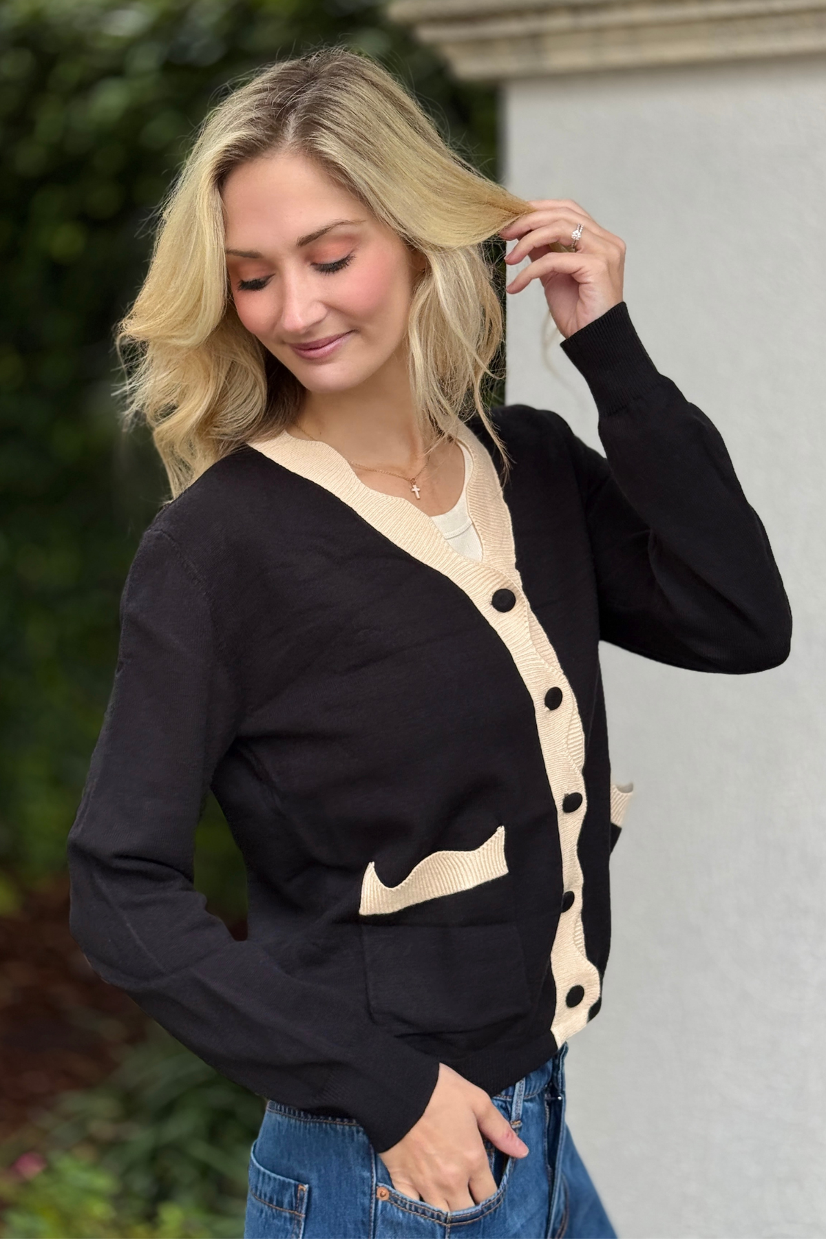 Close up of scalloped neckline and button detail