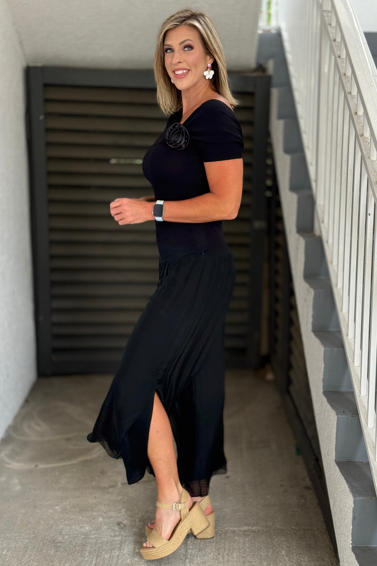 Wide leg black silk pants styled with heels
