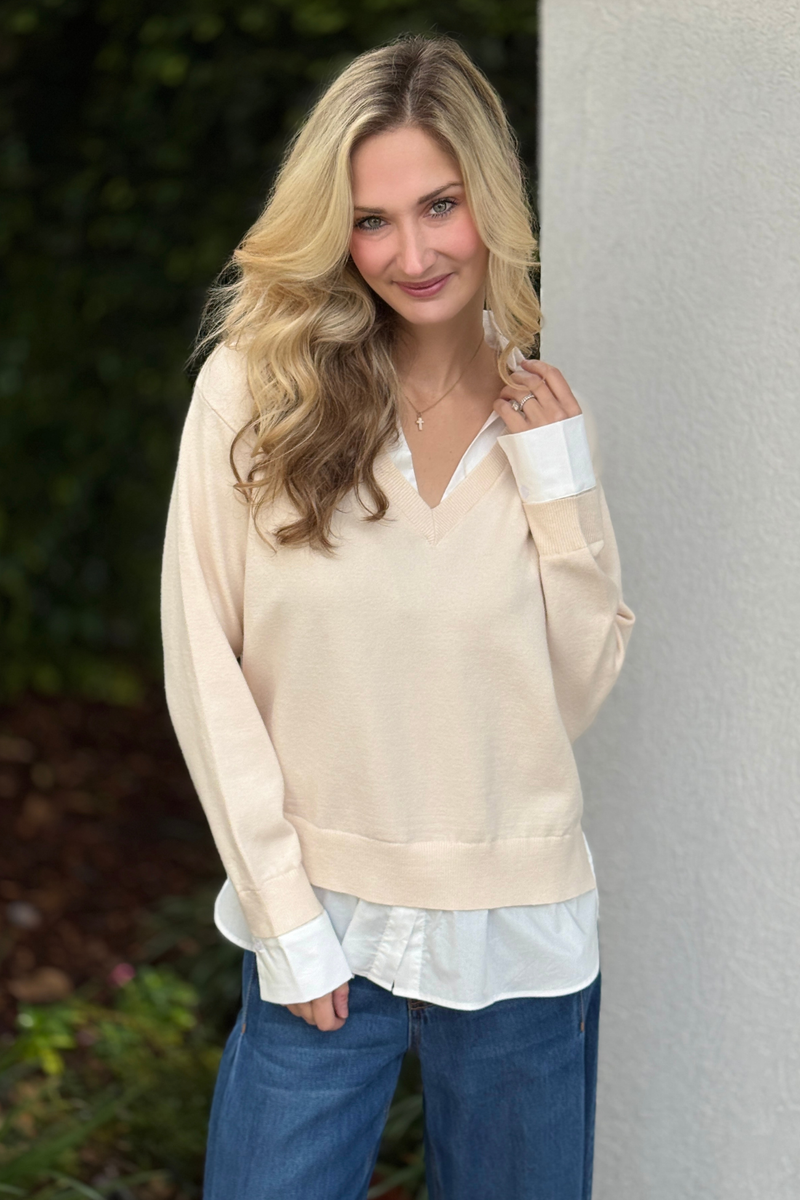 Cream layered v-neck sweater styled with wide leg pants