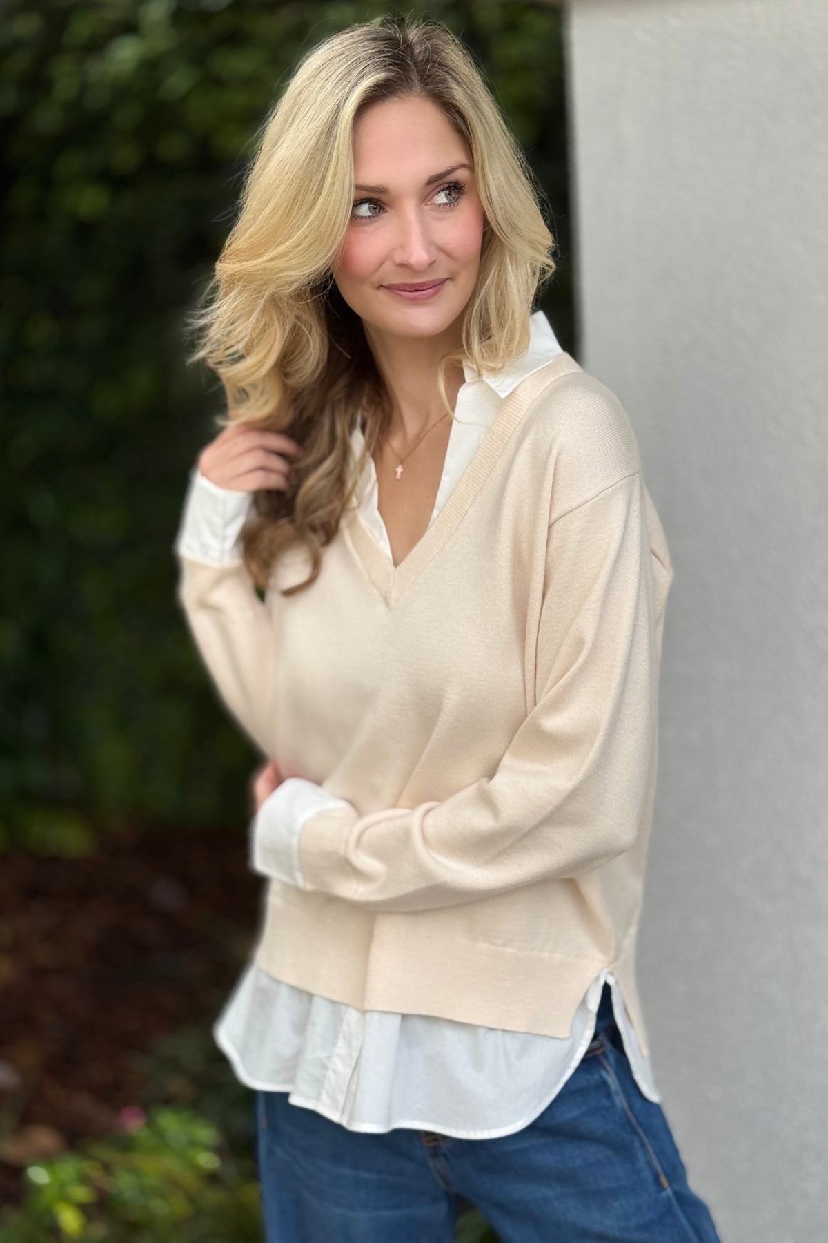 Women’s mixed media sweater with layered hem detail