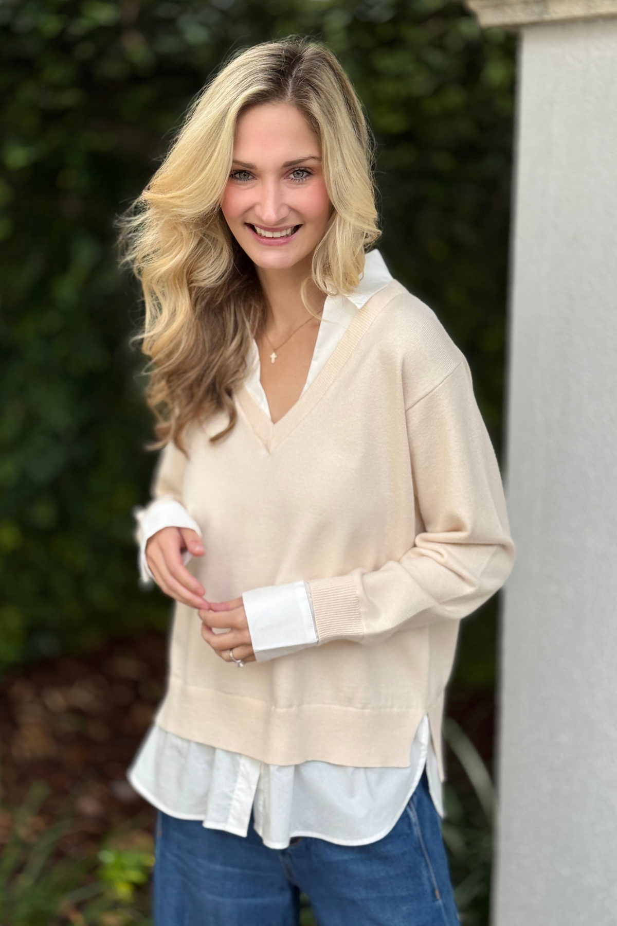 Back view of white mixed media layered sweater for women