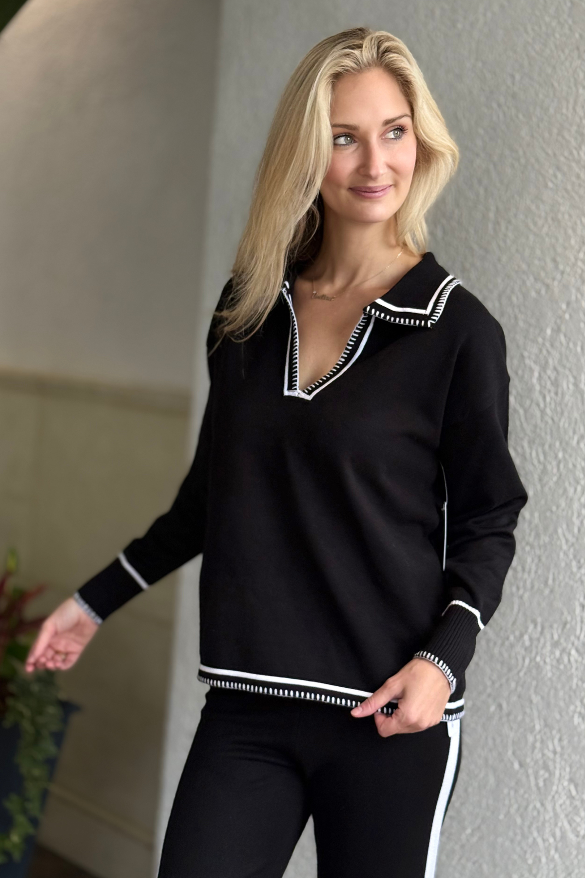 Close-up of white contrast stitching detail on the Six Fifty Kellie Top collar and cuffs.