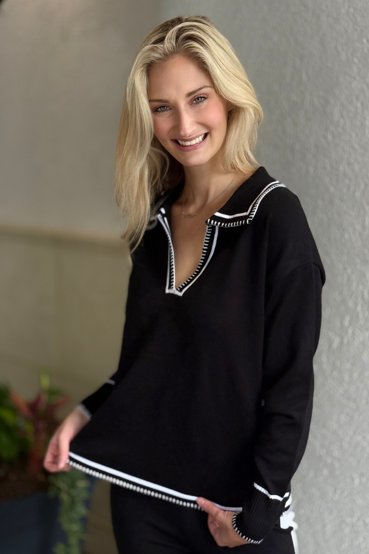 Six Fifty Kellie Contrast Stitch Top shown front view — black pullover with chic white trim.