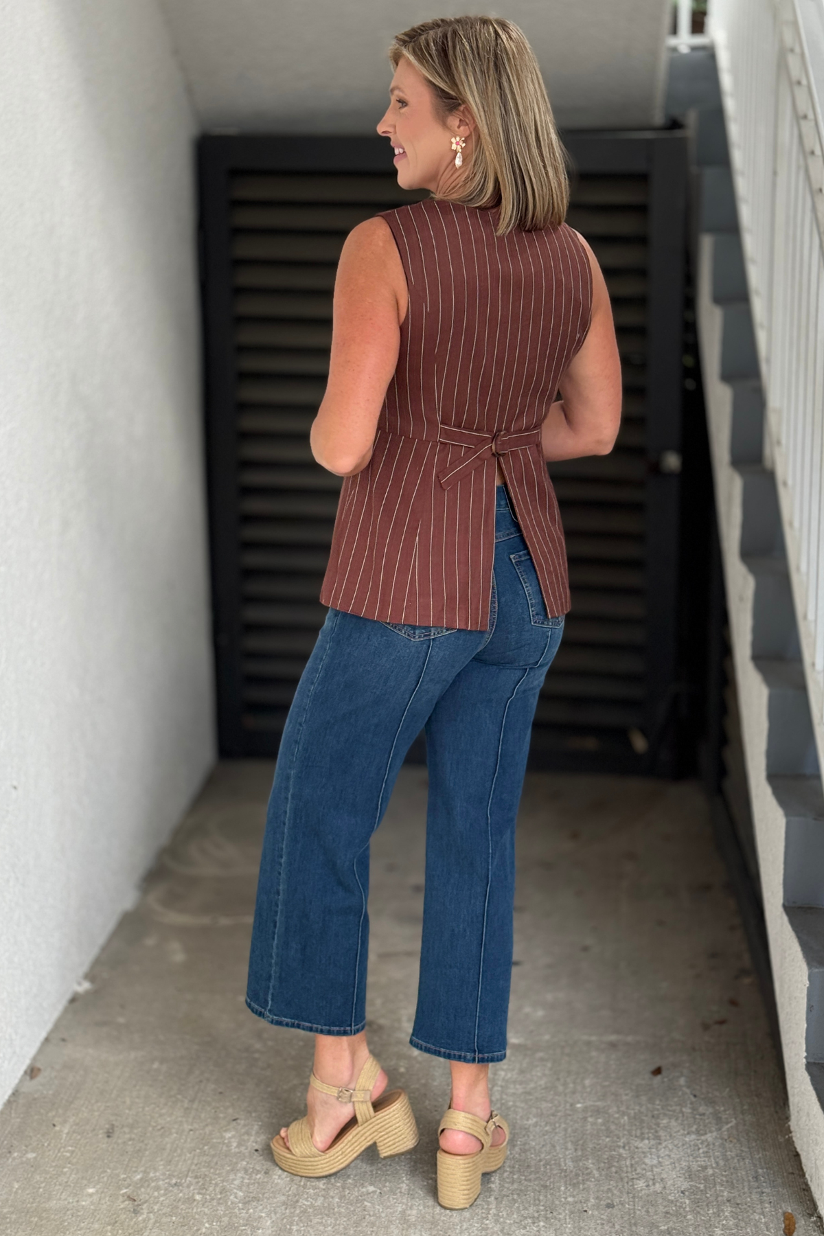 Brown boutique vest top with faux welt pockets and button front