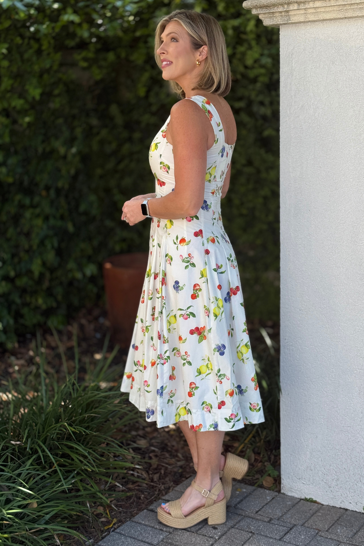 Flattering summer dress styled with wedge sandals