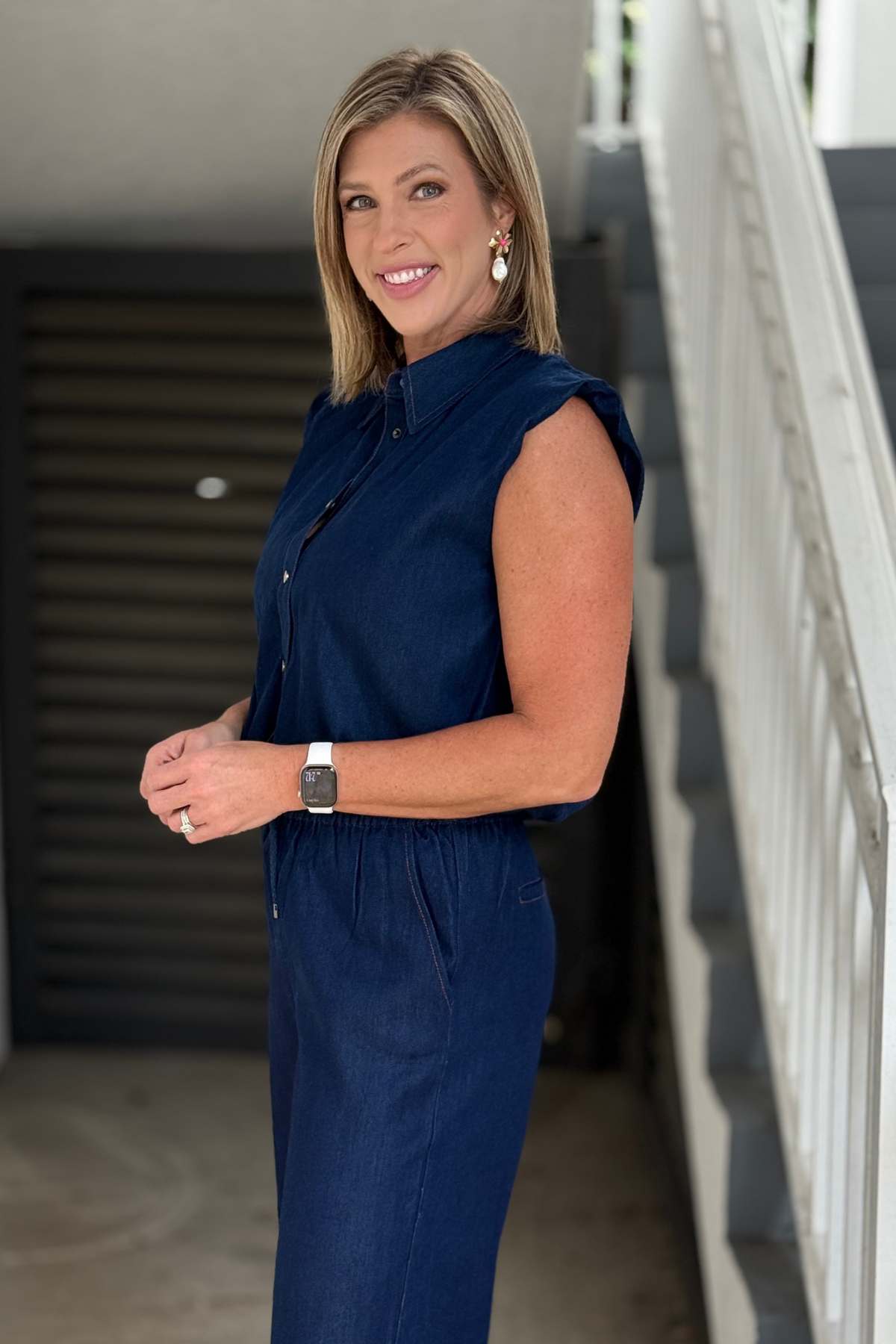 Indigo sleeveless denim top styled with matching drawstring pants