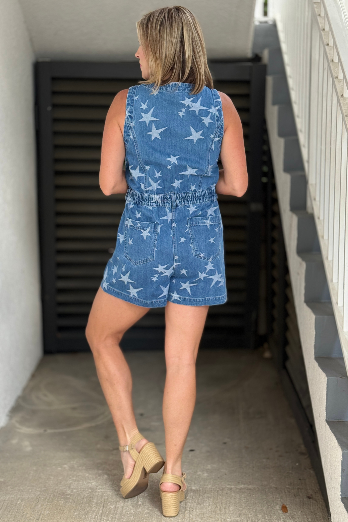 Relaxed fit sleeveless romper with vintage denim wash