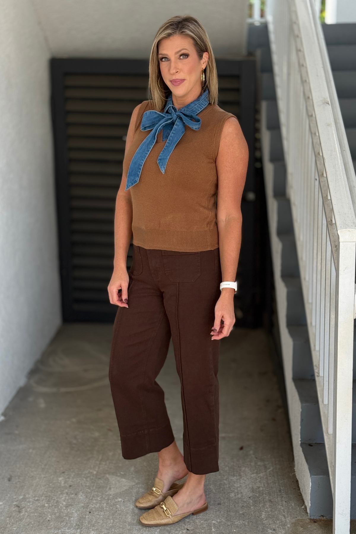 Women’s fall sleeveless knit top with oversized denim bow detail