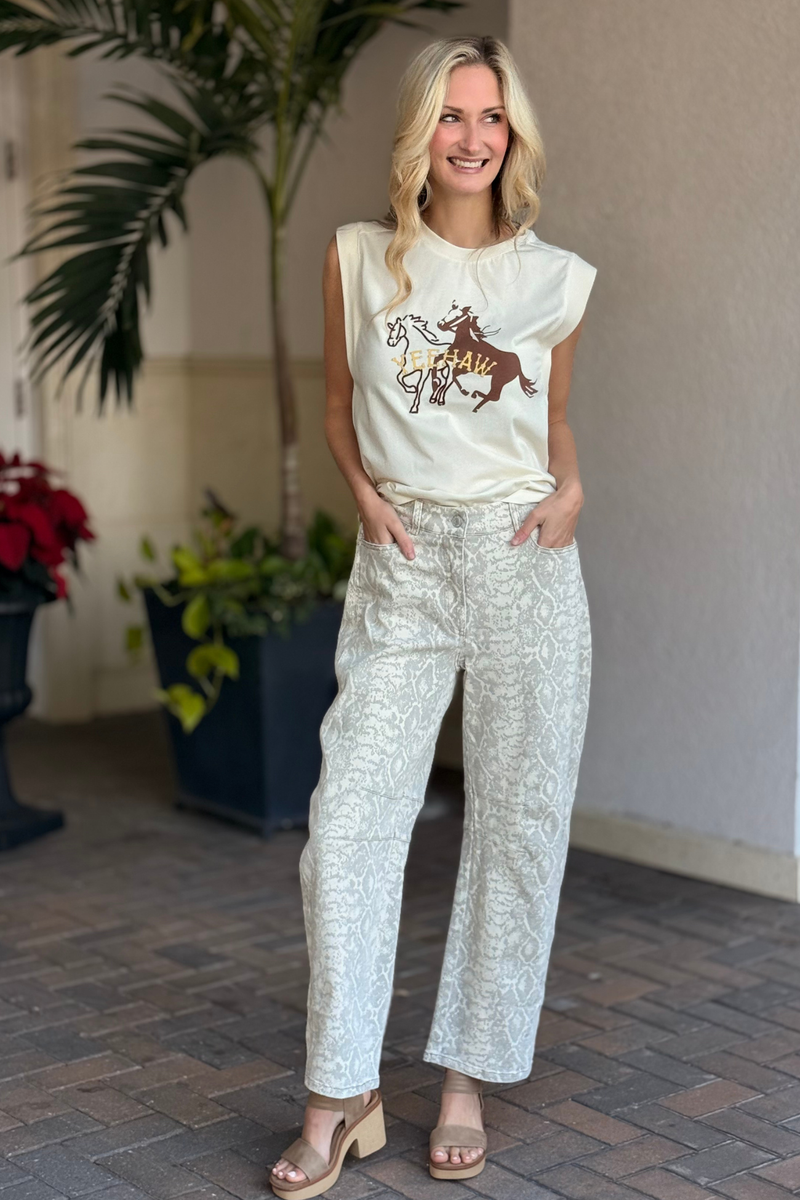 Close-up front view of snake print high-waist barrel twill pants