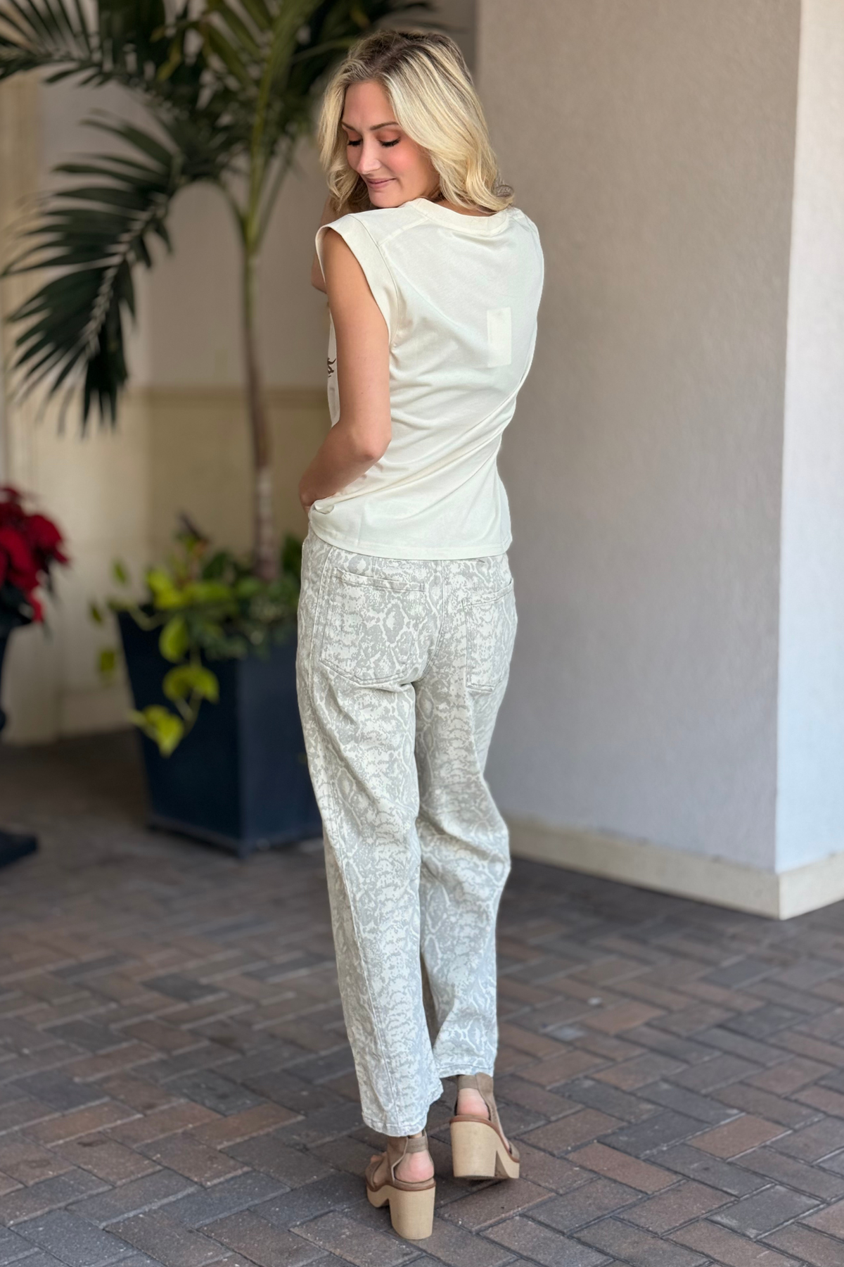Back view of snake print pants with elastic waistband detail