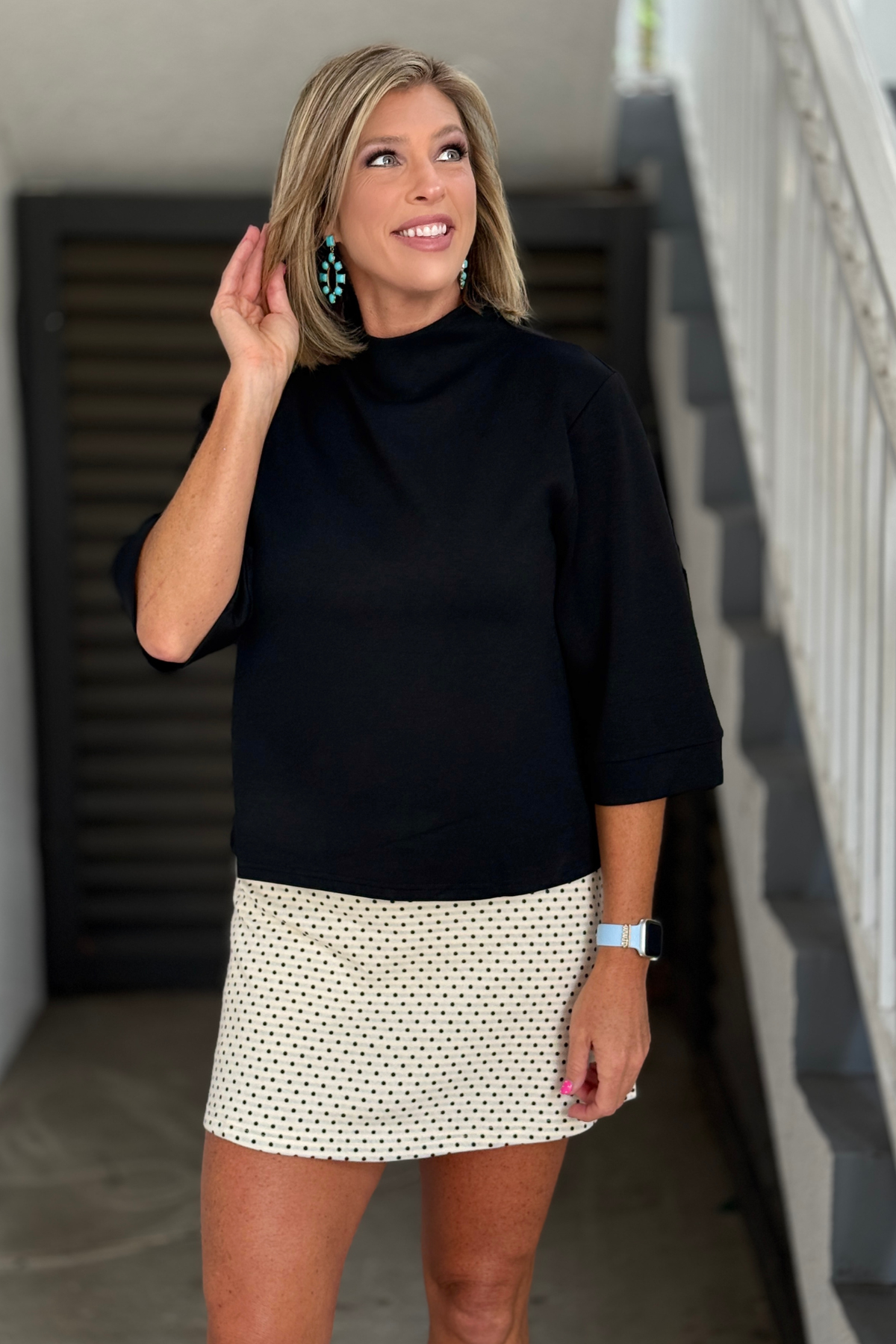 Women's black mock neck knit top