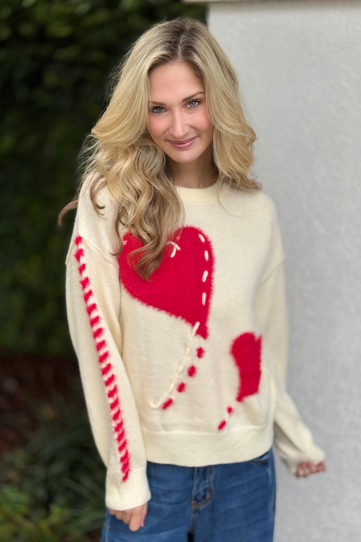 Valentine inspired fuzzy heart sweater styled with denim
