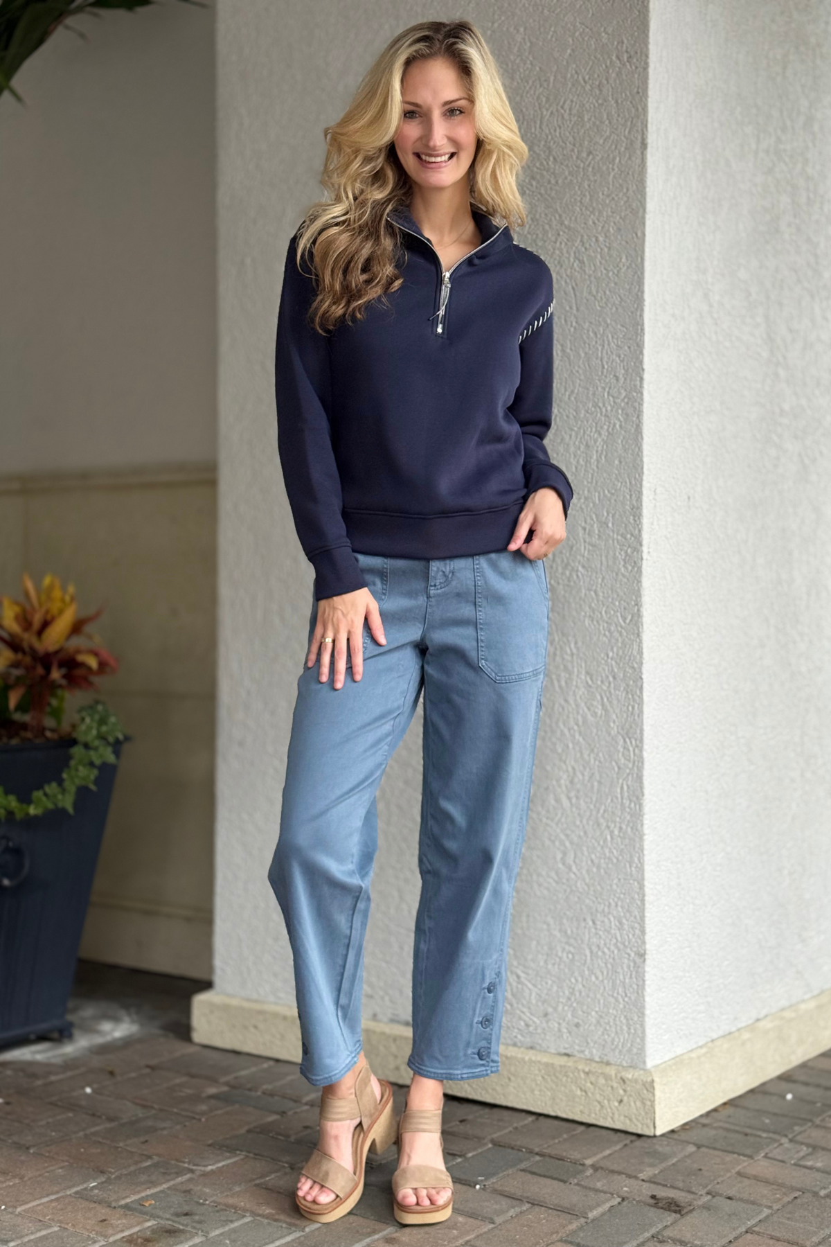Model wearing the Tribal Everyday Ease Stretch Twill Ankle Pant with button hem vent detail