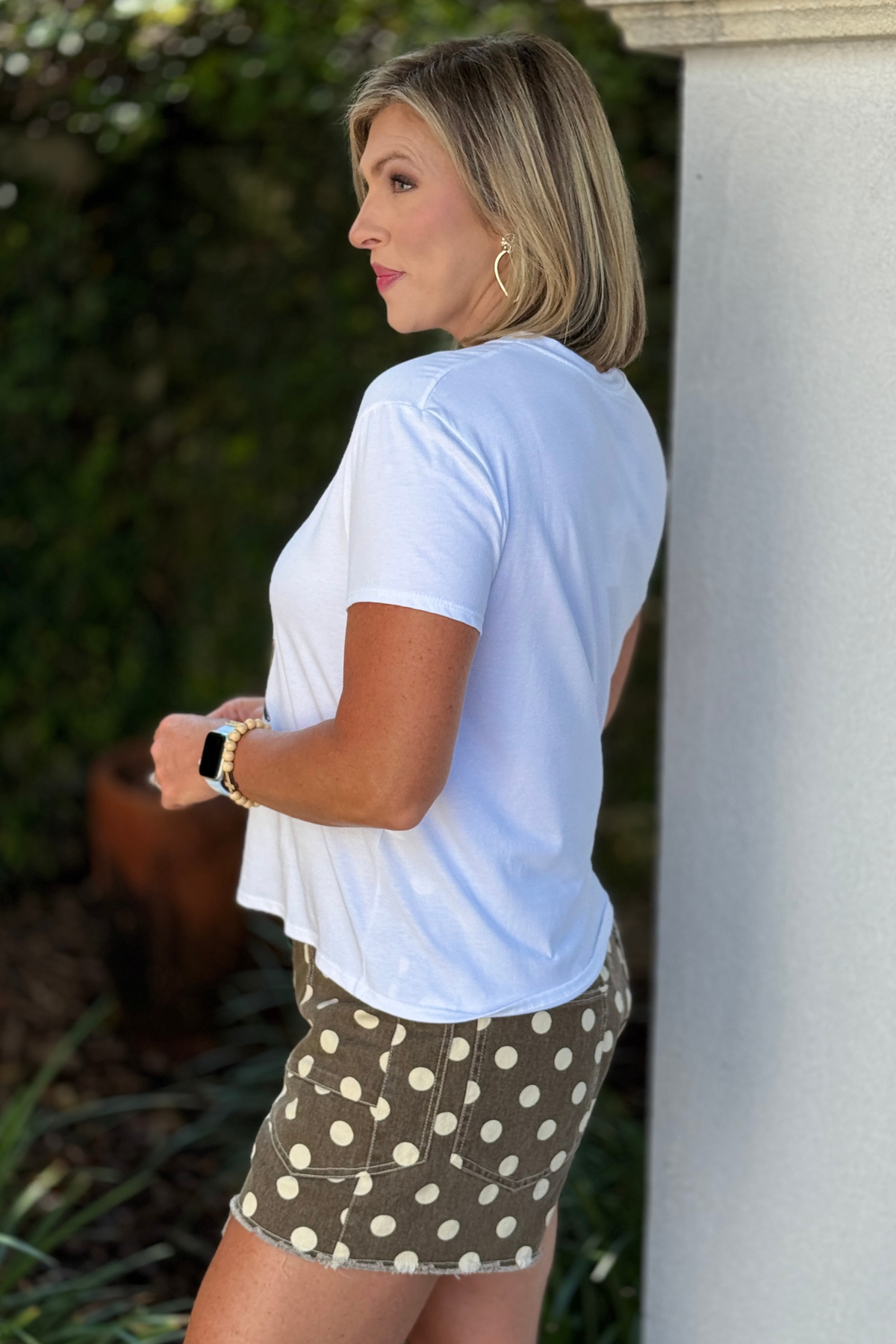 Back view of white short sleeve boutique graphic tee